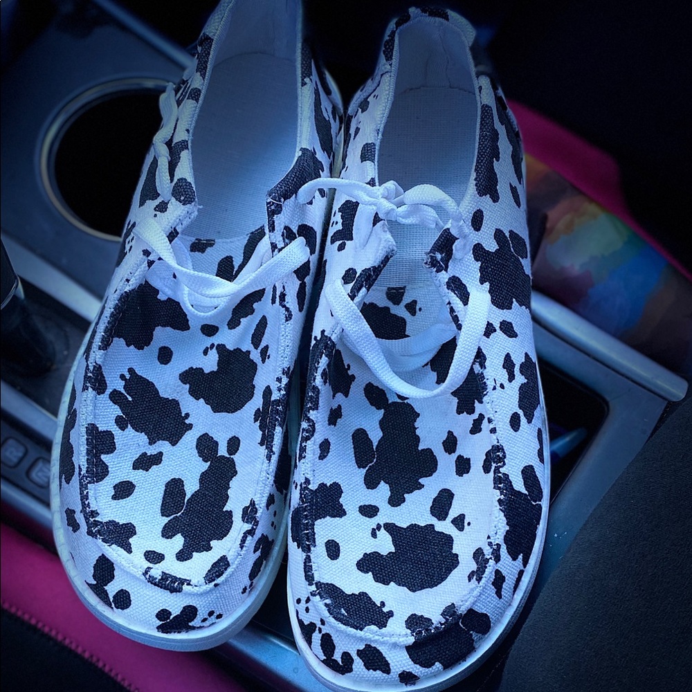 Cow print slip on shoes
